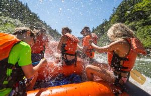 Rafting on the Rogue River rapids, being splashed - First person view.