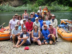 Large group gathers for photo on a rafting vacation on the Rogue River