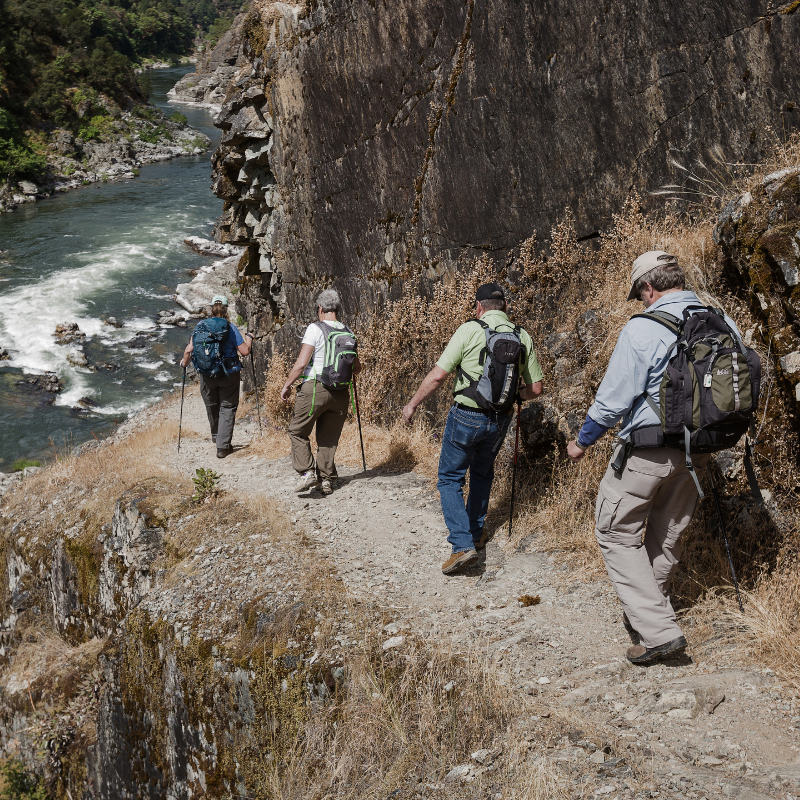 rogue river hiking feature people hiking along the Rogue River Trail in southern Oregon